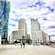 A wide pedestrian walkway with modern skyscrapers